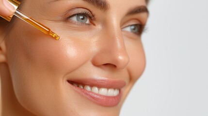 Brightening skin treatment with facial oil applied by a woman in a calm setting