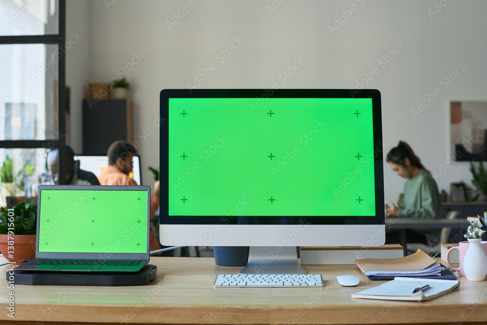 Aufkleber Chromakey screens of two office computers standing on workplace of software developer or information technology engineer