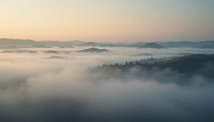 Naklejka premium Captivating sunrise over misty mountains nature landscape aerial view tranquil environment scenic beauty