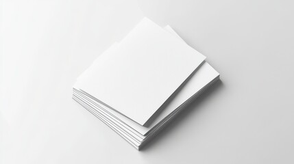 Business card mockups fan out on a white textured paper background.