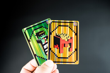 Fototapeta premium Bangkok, Thailand - April 6, 2025 : Card of Zombie hamburglar and Minecraft fries helmet, Minecraft blind box from McDonald's collaborates