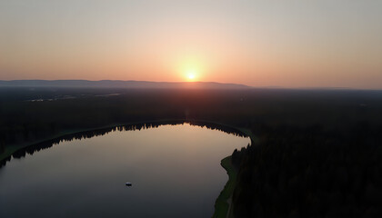 Obraz premium Serene Sunrise Over a Mountain Lake