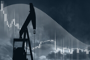 Oil rig on a background of a dramatic sky with down arrow. Symbol of the collapse in the oil...