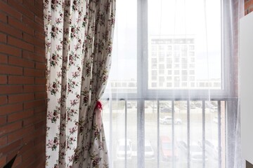 the balcony of an apartment on the upper floors of an apartment building