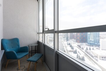 the balcony of an apartment on the upper floors of an apartment building