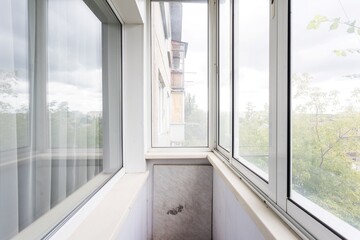 Fototapeta premium the balcony of an apartment on the upper floors of an apartment building