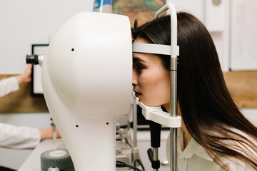 Corneal topography eye vision test for visual description of the shape and power of the cornea. Red...