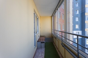 the balcony of an apartment on the upper floors of an apartment building