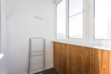 the balcony of an apartment on the upper floors of an apartment building