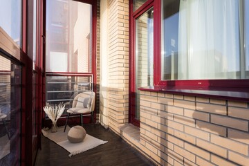 the balcony of an apartment on the upper floors of an apartment building