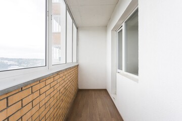 the balcony of an apartment on the upper floors of an apartment building