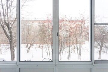 the balcony of an apartment on the upper floors of an apartment building