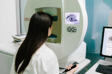 Perimetry eyes test for early sign of glaucoma of woman patient of ophthalmology clinic. Perimetry...