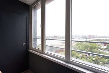 Fototapeta premium the balcony of an apartment on the upper floors of an apartment building