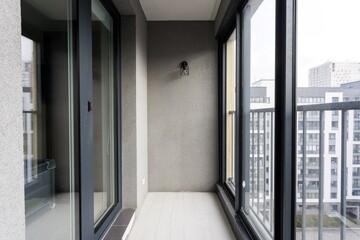 the balcony of an apartment on the upper floors of an apartment building