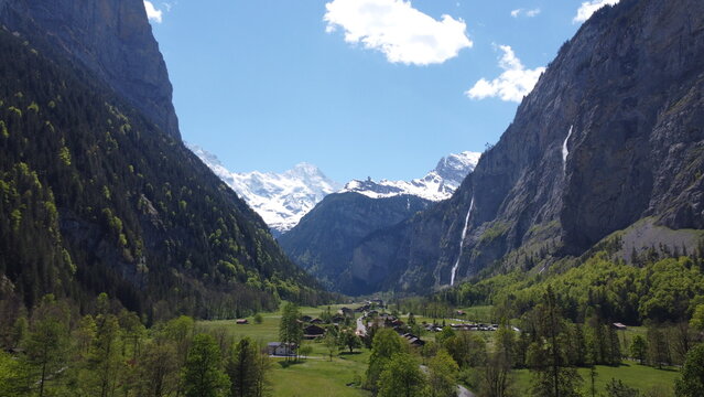 DCIM\100MEDIA\DJI_0463.JPG
A stunning aerial view of Lauterbrunnen Valley in Switzerland. Snow-capped mountains, lush green meadows, and waterfalls create a peaceful alpine scenery. 
