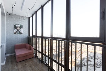 the balcony of an apartment on the upper floors of an apartment building