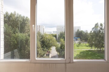 the balcony of an apartment on the upper floors of an apartment building