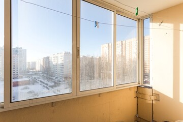 the balcony of an apartment on the upper floors of an apartment building