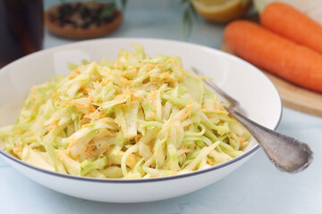 A bowl with coleslow salad