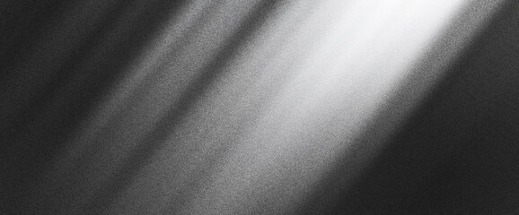 Subtle grainy noise texture with white light on black gradient, creating a smooth abstract gradient design