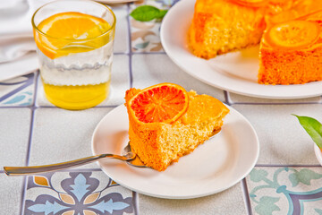 Orange cake with fruit citrus slices.