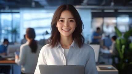Smiling japanese business professional in modern office laptop in hand bright environment positive vibes