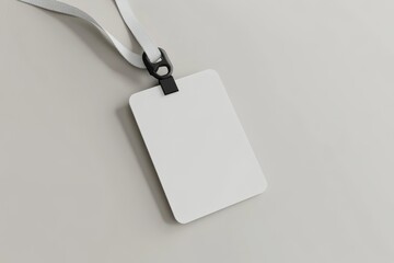 Blank white ID card with lanyard on light grey background.