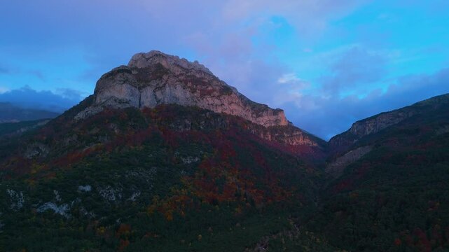 Sunset and autumn landscape of the mixed forest of beech, pine and fir trees in the Oza Forest in the Western Valleys Natural Park. La Jacetania region. Huesca. Aragon. Spain. Europe.