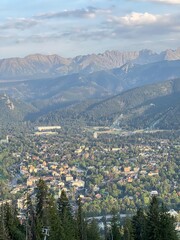 Scenic aerial view of Zakopane town nestled in green forested mountains