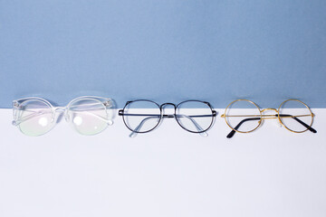 Glasses, set of glasses for vision, on white and blue background, with space for text