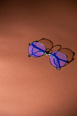 Glasses for vision, glasses with protective coating, with space for text, on a brown background