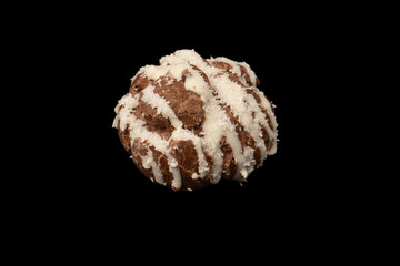 Profiteroles with coconut cream on a black background.