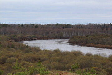 Vyatka river flowing in the forest of north-eastern Europe on a spring day