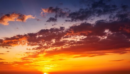 Fototapeta premium Colorful sunset. Red orange yellow sky with clouds. Beautiful bright evening sky background for design.