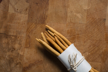Top view of fried corn stick snack on a wood board, Overhead view of nigerian kokoro corn snack