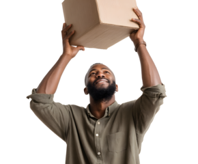 Man holding cardboard box with both hands, smiling up at it. He's wearing a green shirt, on a black backdrop.