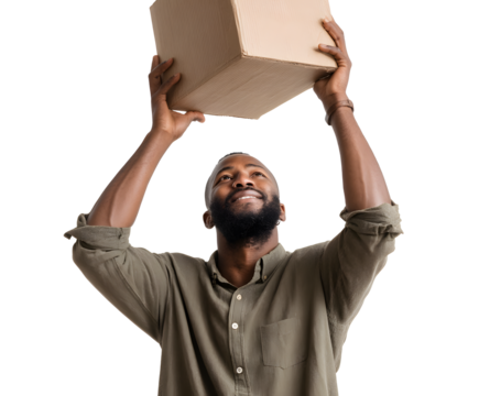 Man holding cardboard box with both hands, smiling up at it. He's wearing a green shirt, on a black backdrop.