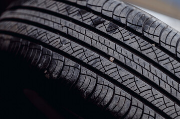 Stone stuck in tire groove.Stones stuck in the tire grooves affect the tire's performance.