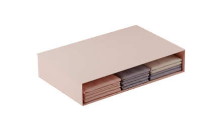 A close up of a pink drawer containing neatly folded towels of varying colors on a white background