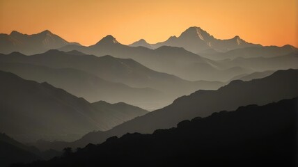 The mountains are covered in snow and the sun is setting behind them