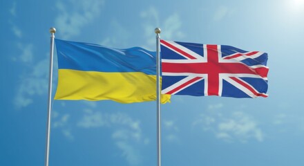 National Flags of Ukraine and the United Kingdom Flying Side by Side Against a Clear Blue Sky