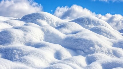 Obraz premium Snow-covered mounds under a vibrant blue sky. Possible use stock photo for winter scenes