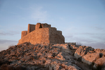 Consuegra Castle: A Stunning Fortress in Toledo, Spain at Sunset