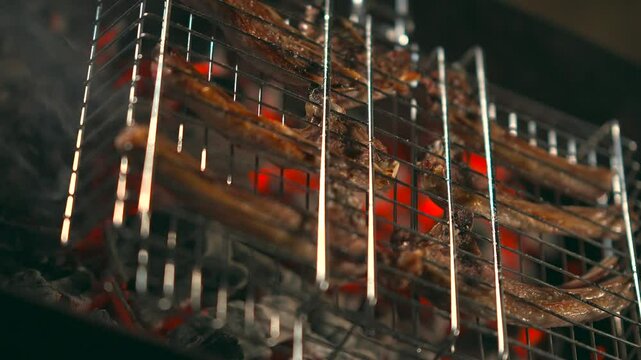 Meat is cooked on the grill, mutton on the grill, the process of cooking mutton on the grill