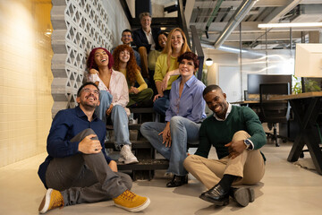 Multi-ethnic team enjoying break time in coworking space