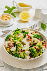 Italian Broccoli Cauliflower Salad in a white bowl