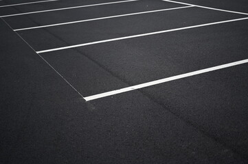 white arrow on gray asphalt, turn left, turn right, abstract white lines on asphalt, background of asphalt texture and white lines	

