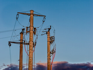 Power lines against a dawn sky in Arad, Romania