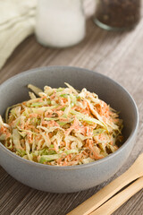 Fresh homemade coleslaw salad made of chopped white cabbage, grated carrot and mayonnaise served in...